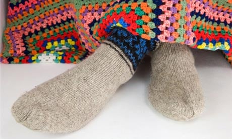 Feet in woollen knitted sock