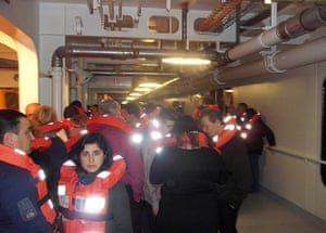 Cruise Aground: Passengers wearing life-vests on board the Costa Concordia