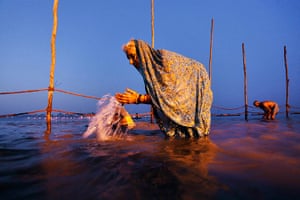 Ganges: An older devotee raises water to her face