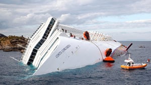Concordia: Rescuers stand in a boat next to the Costa Concordia cruise