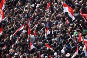 Egypt one year rally: Egyptian Muslim Brotherhood Elder Safwat Hegazy is carried 