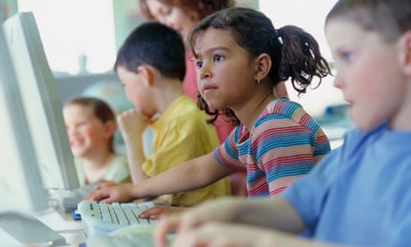 Children working on computers in school.