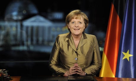 German Chancellor Merkel poses for photographs after recording of her annual New Year's speech
