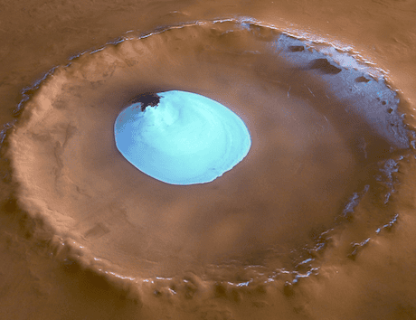 A patch of brilliant white water ice sitting in a Martian crater.