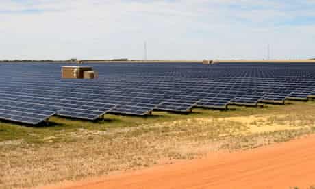 Rows of solar panels at the Greenough River Solar project near the town of Walkaway, Australia