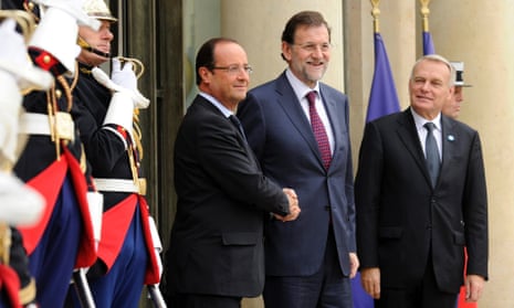 French President Francois Hollande (L) greets Spanish Prime Minister Mariano Rajoy (R) upon his arrival at the Elysee Palace to attend the Franco-Spanish Summit in Paris, France.