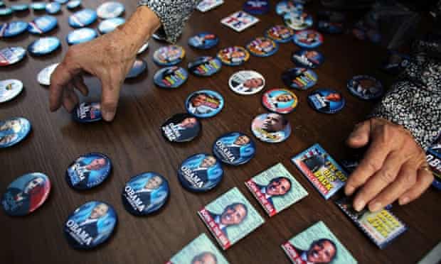 Buttons of President Barack Obama are displayed at a table set up by the Three Peaks Independent Democrats in the Upper West Side of Manhattan.