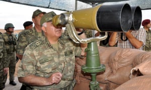 Turkey's chief staff Necdet Ozel inspects troops along the border with neighbouring Syria.