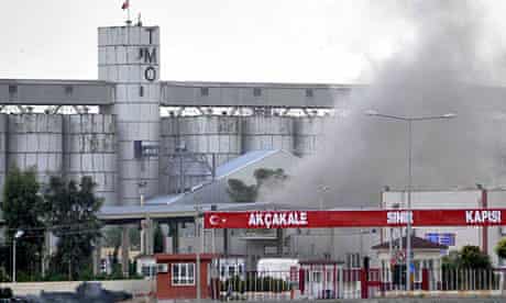 Smoke rises after a Syrian shell fell on Akcakale, Turkey