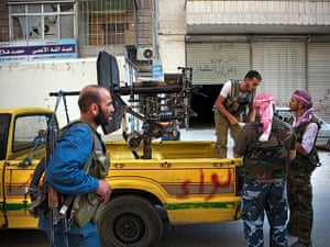 FTA: Maysun: Free Syrian Army fighters reload an anti-aircraft gun