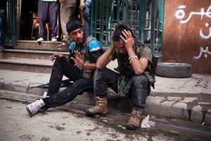 FTA: Maysun: A Free Syrian Army fighter cries after one of his friends was injured