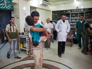 FTA: Maysun: A father cries as he carries his dead child into Dar al Shifa hospital