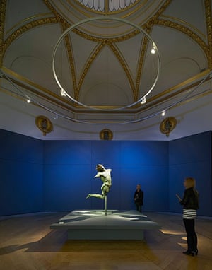 Stanton Williams projects: A bronze statue is lit against a rich blue background