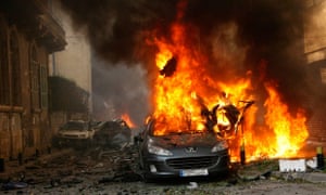 A car burns at the site of an explosion in Beirut