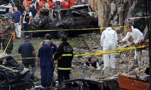 Lebanese forensic experts examine the site .