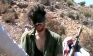 An image grab taken from a video on YouTube on October 1, 2012 shows American freelance journalist  Austin Tice, 31-years-old,  blindfolded with men believed to be his captors at an undisclosed location in Syria.