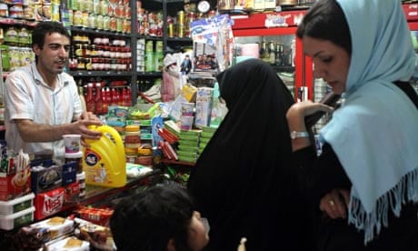 Women buy groceries in Tehran