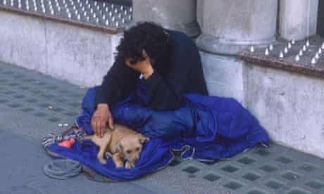 Homeless man with dog in London