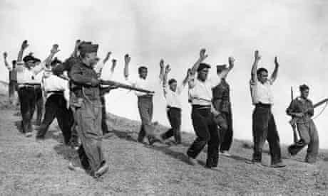 Republican soldiers surrender to Franco's troops in 1936