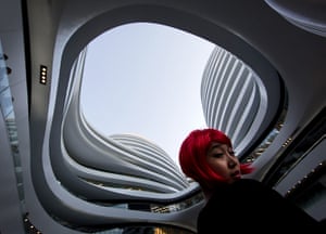 24 hours: Beijing, China: A hostess stands in the newly opened Galaxy Soho building