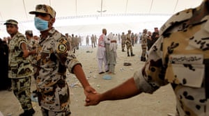 24 hours: Mina, Saudi Arabia: Saudi soldiers cordon Muslim pilgrims 
