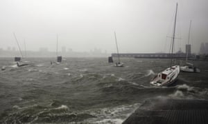 Sailboats rock in choppy water at a dock along the Hudson River Greenway ahead of Hurricane Sandy in New York.