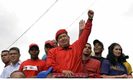 Venezuelan President Hugo Chavez raises