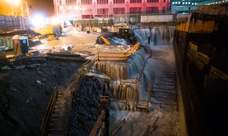 Seawater floods the ground zero construction site, where One World Trade Center is being built
