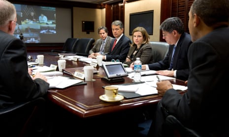 Barack Obama receives an update on the ongoing response to Hurricane Sandy on Tuesday, in the Situation Room of the White House.