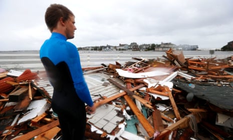 Currie Wagner looks over the debris from his grandmother Betty Wagner's house, destroyed by Sandy, which ended up atop the Mantoloking Bridge in New Jersey.