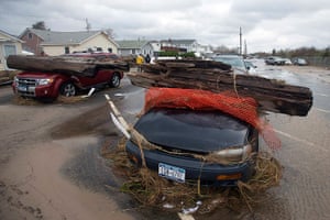 Coastal aftermath: Cars sit under debris at the Breezy Point section of the Queens borough