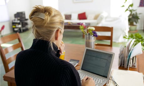 Woman at home using her laptop