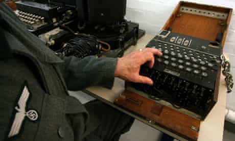 Actor dressed as German soldier shows use of Enigma machine in Bletchley Park Museum