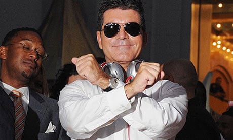 Simon Cowell making the X Factor sign