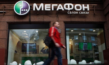 A man walks past a MegaFon mobile shop in Moscow, Russia