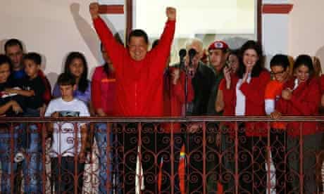 Venezuelan president Hugo Chavez celebrates from people's balcony at Miraflores Palace in Caracas