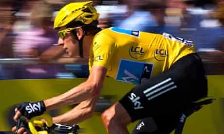 Bradley Wiggins cycling in the leader's yellow jersey