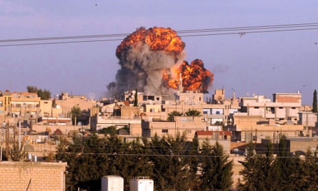 A big explosion is seen after a Syrian aircraft bombed Ras al-Ain town at the Turkish border.