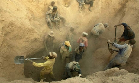 Miners dig for diamonds in the Marange fields, Zimbabwe