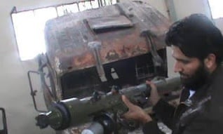 A photo purporting to show a Syrian rebel with an SA16 surface-to-air missile. 