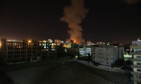 Smoke rises following an Israeli air strike in Gaza City on 14 November 2012.