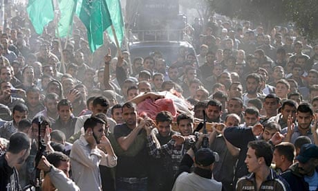 Hamas military commander Ahmed al-Jabari being carried to his funeral on Thursday
