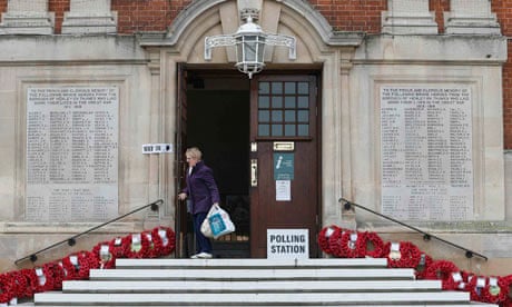 A woman leaves a polling station in Henley-on-Thames