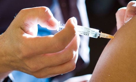 A student receives a measles vaccine injection
