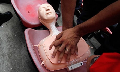 Police officers practise their CPR technique on a mannequin in Bucharest
