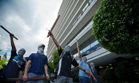 Genetically modified protest: Masked protestors shout slogans against the U.S.-based Monsanto company outside its offices in Buenos Aires, Argentina. The protest was held against copyrighted seeds, the use of soy as a mono-culture and the dominant presence of Monsanto in Argentina.