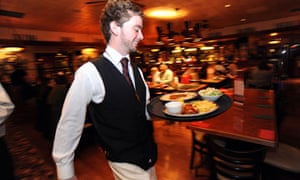 waiter carries tray