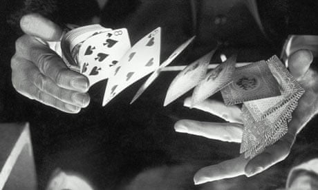 A man shuffling a deck of cards