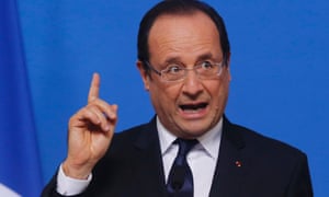 French President Francois Hollande gestures while speaking during a media conference after an EU summit in Brussels on Friday, Nov. 23, 2012.