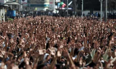 Pakistani Shiite Muslim mourners raise t